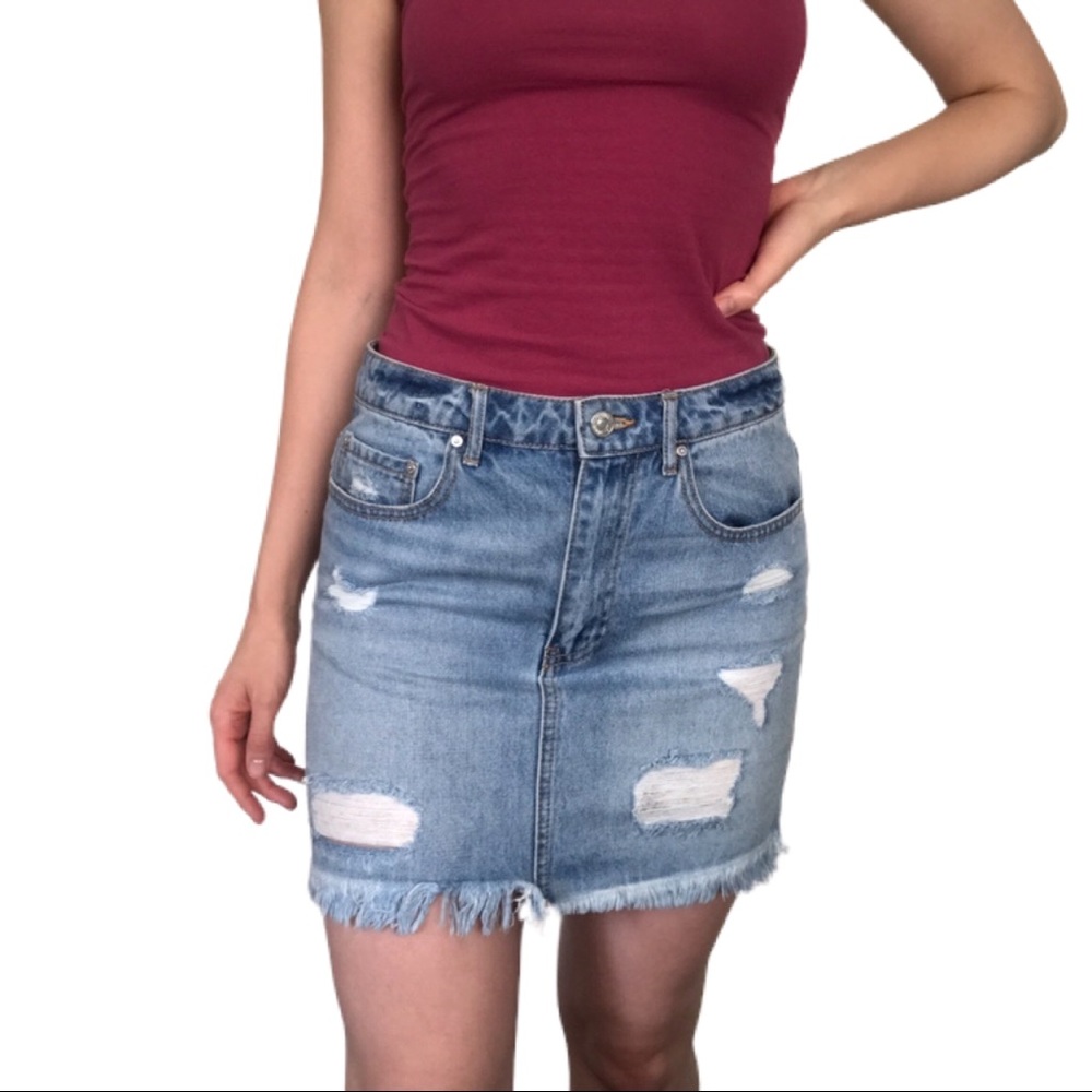 Ripped denim mini skirt light wash raw hem